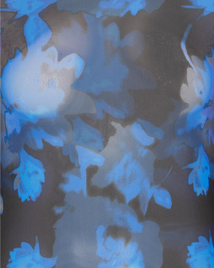 Close-up of blue floral pattern on the mesh shirt